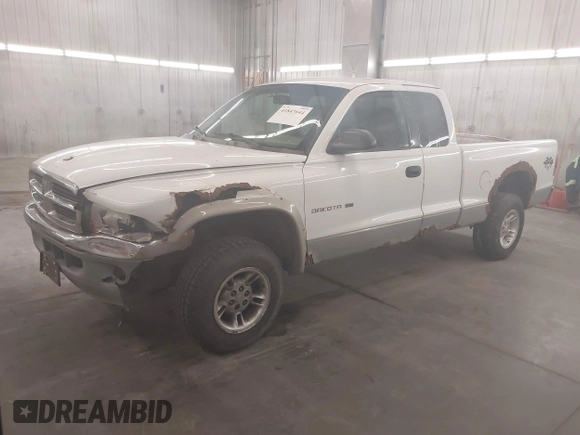 1999 Dodge Dakota SLT with VIN 1B7GG22XXXS254782, listed as a IAAI auction lot 41847644 with 164,607 mi miles and . Bid and sale history available at carsss.com. Image 2.