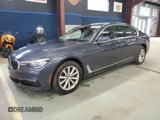 2018 BMW 7 Series 740i xDrive z VIN WBA7E4C54JGV23896, wystawiony jako Copart lot #58200925 z przebiegiem 129 668 mil mil oraz Czysty tytuł • Clean title. Historia ofert i sprzedaży dostępna na DreamBid. Obrazek 1.