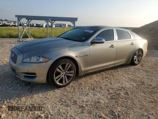 2014 Jaguar XJ Portfolio with VIN SAJWJ2GD7E8V61558, listed as a Copart auction lot 66850034 with 130,984 mi miles and Salvage title. Bid and sale history available at DreamBid. Image 1.