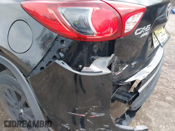2015 Mazda CX-5 Touring with VIN JM3KE4CY2F0445178, listed as a IAAI auction lot 41828953 with 137,330 mi miles and . Bid and sale history available at DreamBid. Image 6.