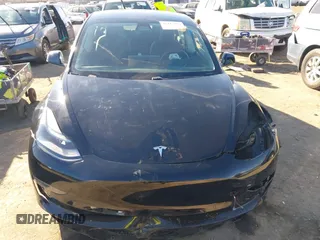 2021 Tesla Model 3 Performance with VIN 5YJ3E1EC6MF999321, listed as a IAAI auction lot 41417451 with 20,562 mi miles and . Bid and sale history available at carsss.com. Image 12.