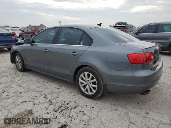 2014 Volkswagen Jetta SE with VIN 3VWD07AJ7EM363186, listed as a Copart auction lot 60873465 with 215,323 mi miles and Salvage title. Bid and sale history available at DreamBid. Image 2.
