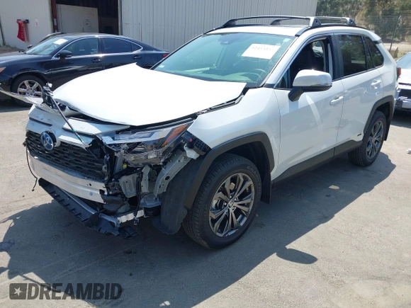 2024 Toyota RAV4 Hybrid XLE Premium with VIN JTMB6RFV9RJ063328, listed as a IAAI auction lot 42433233 with 9,874 mi miles and . Bid and sale history available at DreamBid. Image 2.