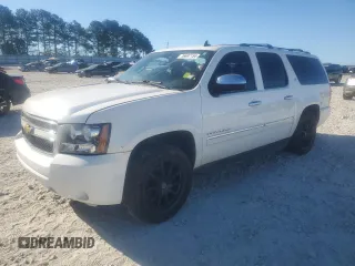 2014 Chevrolet Suburban LTZ with VIN 1GNSCKE02ER105377, listed as a Copart auction lot 76697154 with 229,461 mi miles and Salvage title. Bid and sale history available at DreamBid. Image 2.