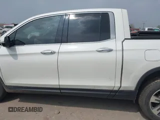 2018 Honda Ridgeline RTL-E with VIN 5FPYK3F77JB004379, listed as a IAAI auction lot 41802025 with 132,085 mi miles and . Bid and sale history available at DreamBid. Image 14.