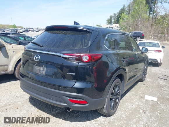 2023 Mazda CX-9 Touring Plus with VIN JM3TCBAY9P0657854, listed as a IAAI auction lot 41931409 with 54,036 mi miles and . Bid and sale history available at DreamBid. Image 4.