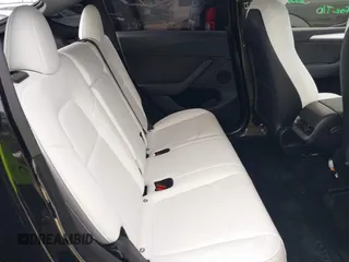 2024 Tesla Model Y Performance z VIN 7SAYGDEF7RA267752, wystawiony jako IAAI lot #42126456 z przebiegiem 21 216 mil mil oraz . Historia ofert i sprzedaży dostępna na DreamBid. Obrazek 8.