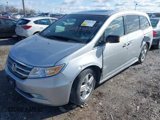 2011 Honda Odyssey Touring with VIN 5FNRL5H92BB049901, listed as a IAAI auction lot 41985224 with 101,957 mi miles and . Bid and sale history available at DreamBid. Image 2.