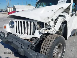 2001 Jeep Wrangler Sahara with VIN 1J4FA59S51P332107, listed as a IAAI auction lot 40954726 with 150,671 mi miles. Bid and sale history available at carsss.com. Image 6.