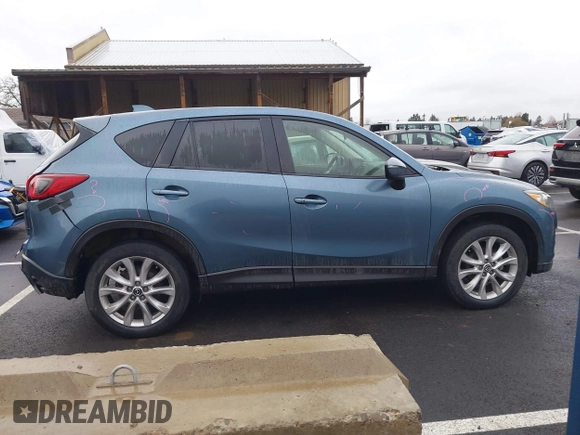 2015 Mazda CX-5 Grand Touring with VIN JM3KE4DY0F0493969, listed as a IAAI auction lot 41581885 with 71,014 mi miles. Bid and sale history available at carsss.com. Image 14.