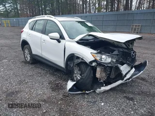 2014 Mazda CX-5 Sport with VIN JM3KE4BE3E0300849, listed as a IAAI auction lot 41942418 with 144,310 mi miles. Bid and sale history available at carsss.com. Image 1.