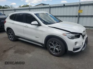 2018 BMW X1 xDrive28i with VIN WBXHT3C35J5F90062, listed as a Copart auction lot 56284945 with 138,137 mi miles and Salvage title. Bid and sale history available at DreamBid. Image 4.