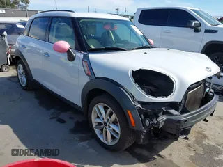 2014 MINI Countryman S with VIN WMWZC3C52EWP26869, listed as a IAAI auction lot 41756310 with 91,941 mi miles and . Bid and sale history available at DreamBid. Image 1.