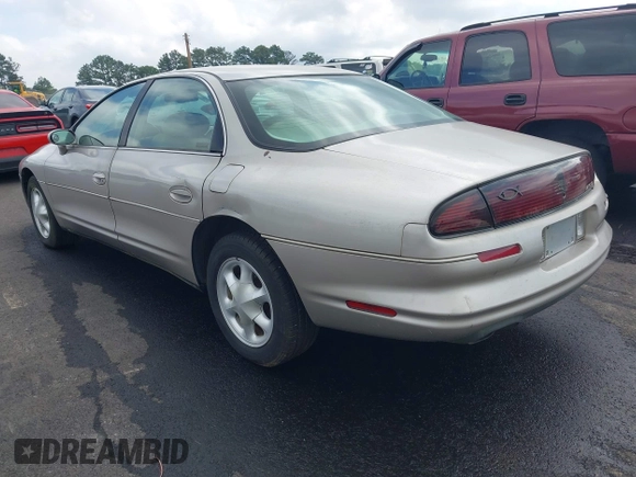 1997 Oldsmobile Aurora z VIN 1G3GR62CXV4121200, wystawiony jako IAAI lot #42277003 z przebiegiem 198 048 mil mil oraz . Historia ofert i sprzedaży dostępna na DreamBid. Obrazek 3.