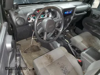 2009 Jeep Wrangler Rubicon with VIN 1J4GA64159L770895, listed as a Copart auction lot 82140864 with 209,464 mi miles and Salvage Title. Bid and sale history available at DreamBid. Image 8.