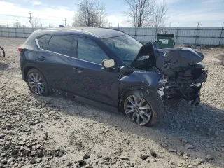 2020 Mazda CX-5 Grand Touring with VIN JM3KFBDM8L0763184, listed as a Copart auction lot 55575105 with 24,855 mi miles and Salvage Title. Bid and sale history available at DreamBid. Image 4.