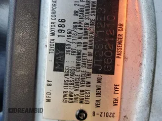 1986 Toyota Camry z VIN JT2SV12E3G6021210, wystawiony jako Copart lot #49623985 z przebiegiem 144 064 mil mil oraz Czysty tytuł • Clean title. Historia ofert i sprzedaży dostępna na DreamBid. Obrazek 12.