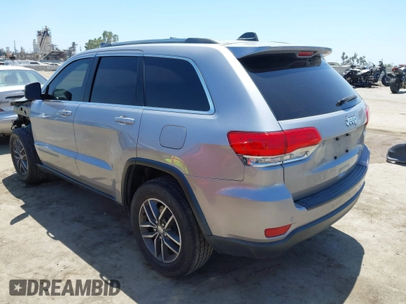 2018 Jeep Grand Cherokee Laredo E with VIN 1C4RJEAG2JC429850, listed as a IAAI auction lot 42541574 with 72,009 mi miles and . Bid and sale history available at DreamBid. Image 3.