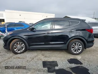 2018 Hyundai Santa Fe 2.0T z VIN 5NMZUDLA3JH057978, wystawiony jako IAAI lot #41930580 z przebiegiem 118 100 mil mil oraz . Historia ofert i sprzedaży dostępna na DreamBid. Obrazek 14.
