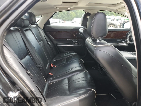 2018 Jaguar XJ with VIN SAJWA1C76J8W14271, listed as a Copart auction lot 73777914 with 124,155 mi miles and Salvage Title. Bid and sale history available at carsss.com. Image 10.