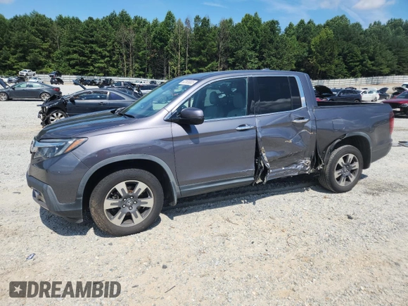 2017 Honda Ridgeline RTL-E with VIN 5FPYK3F79HB031142, listed as a Copart auction lot 62365885 with 134,517 mi miles and Salvage title. Bid and sale history available at DreamBid. Image 1.