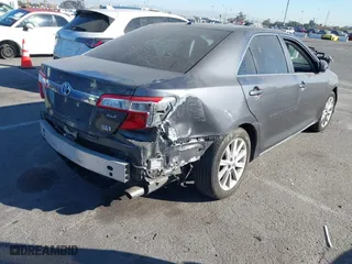 2014 Toyota Camry Hybrid LE with VIN 4T1BD1FK5EU106743, listed as a IAAI auction lot 41323019 with 84,511 mi miles. Bid and sale history available at carsss.com. Image 4.