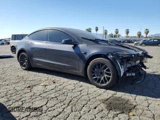 2025 Tesla Model 3 Long Range with VIN 5YJ3E1EA1SF878806, listed as a Copart auction lot 50427005 with 9,790 mi miles and Salvage Title. Bid and sale history available at DreamBid. Image 4.