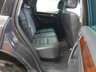 2010 Volkswagen Touareg VR6 z VIN WVGBF7A91AD002407, wystawiony jako IAAI lot #42369975 z przebiegiem 95 504 mil mil oraz . Historia ofert i sprzedaży dostępna na DreamBid. Obrazek 8.