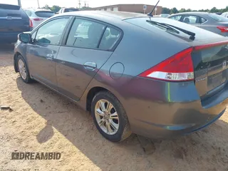 2010 Honda Insight EX with VIN JHMZE2H74AS027020, listed as a IAAI auction lot 42394875 with 248,003 mi miles and . Bid and sale history available at DreamBid. Image 3.