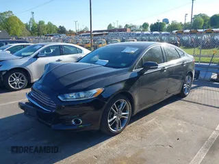 2013 Ford Fusion Titanium with VIN 3FA6P0K99DR374510, listed as a IAAI auction lot 42050026 with 133,227 mi miles and . Bid and sale history available at DreamBid. Image 2.