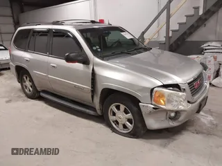 2004 GMC Envoy SLE with VIN 1GKDT13S842217581, listed as a IAAI auction lot 41445234 with 170,310 mi miles. Bid and sale history available at carsss.com. Image 1.