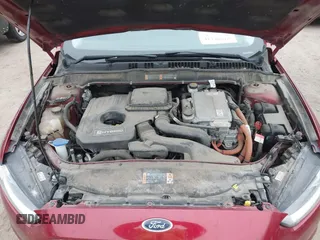 2016 Ford Fusion Titanium Hybrid with VIN 3FA6P0RU3GR355398, listed as a IAAI auction lot 41140669 with 125,959 mi miles. Bid and sale history available at carsss.com. Image 10.