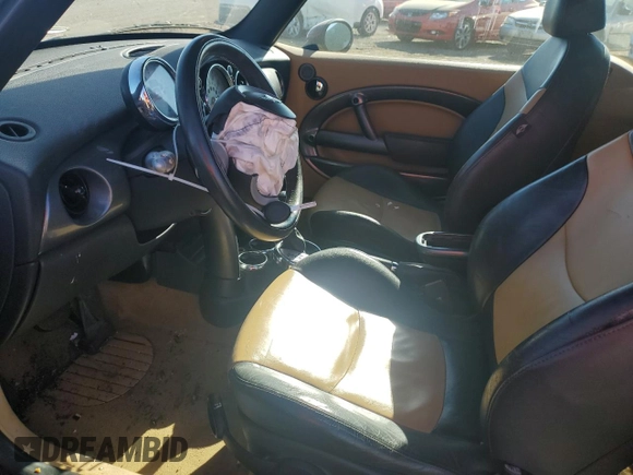 2007 MINI Convertible with VIN WMWRF33557TG17353, listed as a Copart auction lot 78946104 with 98,362 mi miles and Salvage Title. Bid and sale history available at DreamBid. Image 7.