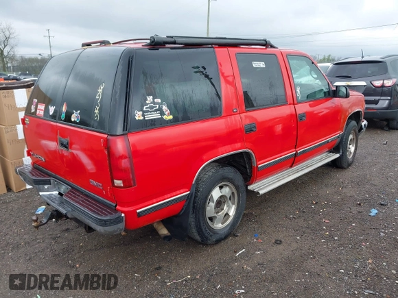 1998 GMC Yukon with VIN 1GKEK13R0WJ703105, listed as a IAAI auction lot 41980869 with 302,546 mi miles. Bid and sale history available at carsss.com. Image 4.