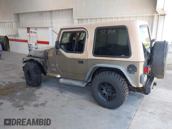 2003 Jeep Wrangler Sahara z VIN 1J4FA59S63P336928, wystawiony jako IAAI lot #42254314 z przebiegiem Nie podano mil oraz . Historia ofert i sprzedaży dostępna na DreamBid. Obrazek 3.