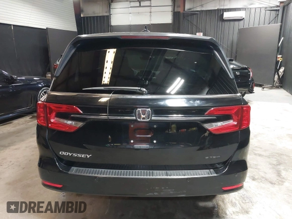 2021 Honda Odyssey Touring with VIN 5FNRL6H83MB040138, listed as a IAAI auction lot 39150096 with 61,322 mi miles and . Bid and sale history available at DreamBid. Image 16.