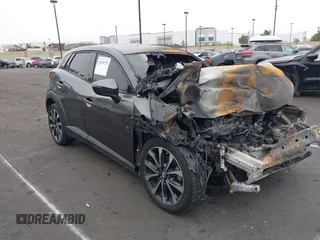 2019 Mazda CX-3 Touring z VIN JM1DKFC78K1401185, wystawiony jako IAAI lot #42034725 z przebiegiem Nie podano mil oraz . Historia ofert i sprzedaży dostępna na DreamBid. Obrazek 1.