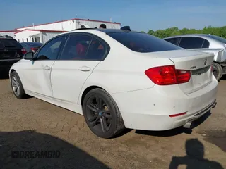 2013 BMW 3 Series 335i xDrive with VIN WBA3B9C54DF587421, listed as a IAAI auction lot 42165857 with 142,331 mi miles. Bid and sale history available at carsss.com. Image 3.
