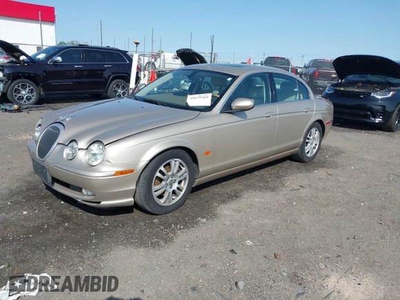 2005 Jaguar S-Type with VIN SAJWA01T95FN22745, listed as a IAAI auction lot 41898269 with 57,614 mi miles and . Bid and sale history available at DreamBid. Image 2.