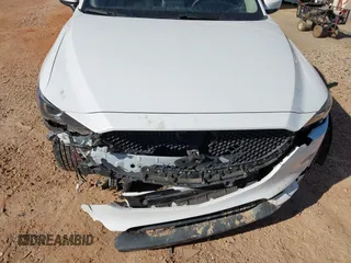 2019 Mazda CX-5 Sport with VIN JM3KFBBM0K0574255, listed as a IAAI auction lot 41661924 with 93,851 mi miles and . Bid and sale history available at DreamBid. Image 6.