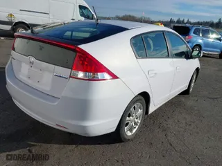 2010 Honda Insight EX with VIN JHMZE2H7XAS015986, listed as a IAAI auction lot 41229343 with 137,276 mi miles. Bid and sale history available at carsss.com. Image 4.
