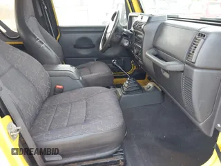 2002 Jeep Wrangler X z VIN 1J4FA39S82P719241, wystawiony jako IAAI lot #42150742 z przebiegiem 147 914 mil mil oraz . Historia ofert i sprzedaży dostępna na DreamBid. Obrazek 5.
