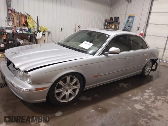 2004 Jaguar XJ with VIN SAJWA71C04SG33993, listed as a IAAI auction lot 41193040 with 79,944 mi miles. Bid and sale history available at carsss.com. Image 17.