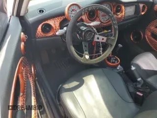 2004 MINI Hardtop with VIN WMWRC33444TC50103, listed as a Copart auction lot 63449615 with 144,467 mi miles and Salvage title. Bid and sale history available at DreamBid. Image 8.