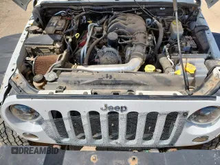 2012 Jeep Wrangler Unlimited Sport with VIN 1C4BJWDG9CL187421, listed as a Copart auction lot 61411145 with 140,390 mi miles and Clean title. Bid and sale history available at DreamBid. Image 12.