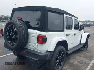 2022 Jeep Wrangler Unlimited Sahara with VIN 1C4JJXP69NW229124, listed as a IAAI auction lot 42525560 with 45,857 mi miles and . Bid and sale history available at DreamBid. Image 4.