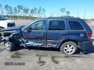 2009 Jeep Grand Cherokee Laredo with VIN 1J8HR48P19C540785, listed as a IAAI auction lot 41729851 with 205,504 mi miles. Bid and sale history available at carsss.com. Image 14.