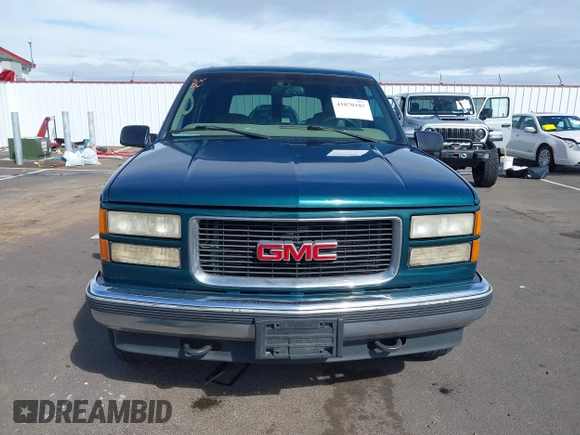1999 GMC Yukon with VIN 1GKEK13R3XJ717999, listed as a IAAI auction lot 41870187 with 179,855 mi miles. Bid and sale history available at carsss.com. Image 12.