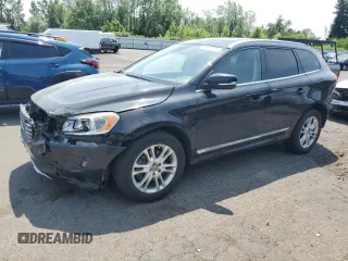 2015 Volvo XC60 T5 Drive-E Premier with VIN YV426MDBXF2587876, listed as a Copart auction lot 60887925 with 98,540 mi miles and Salvage title. Bid and sale history available at DreamBid. Image 1.