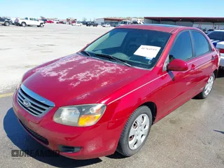 2009 Kia Spectra EX with VIN KNAFE221195606045, listed as a IAAI auction lot 41764519 with 124,577 mi miles. Bid and sale history available at carsss.com. Image 2.